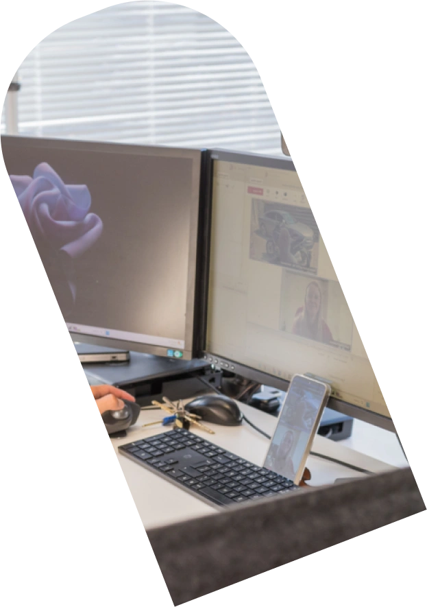 A laptop set up on a desk.