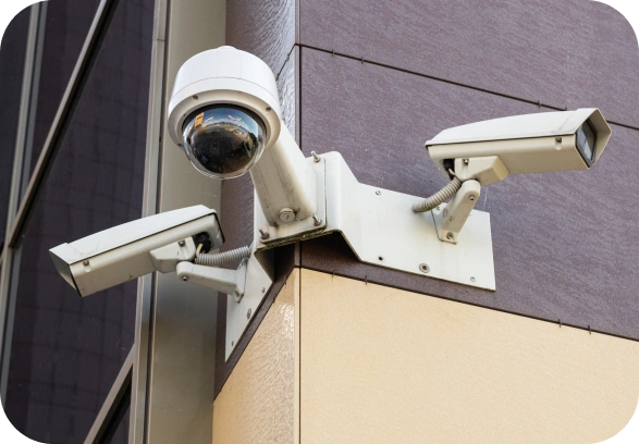 CCTV cameras mounted on a building exterior.